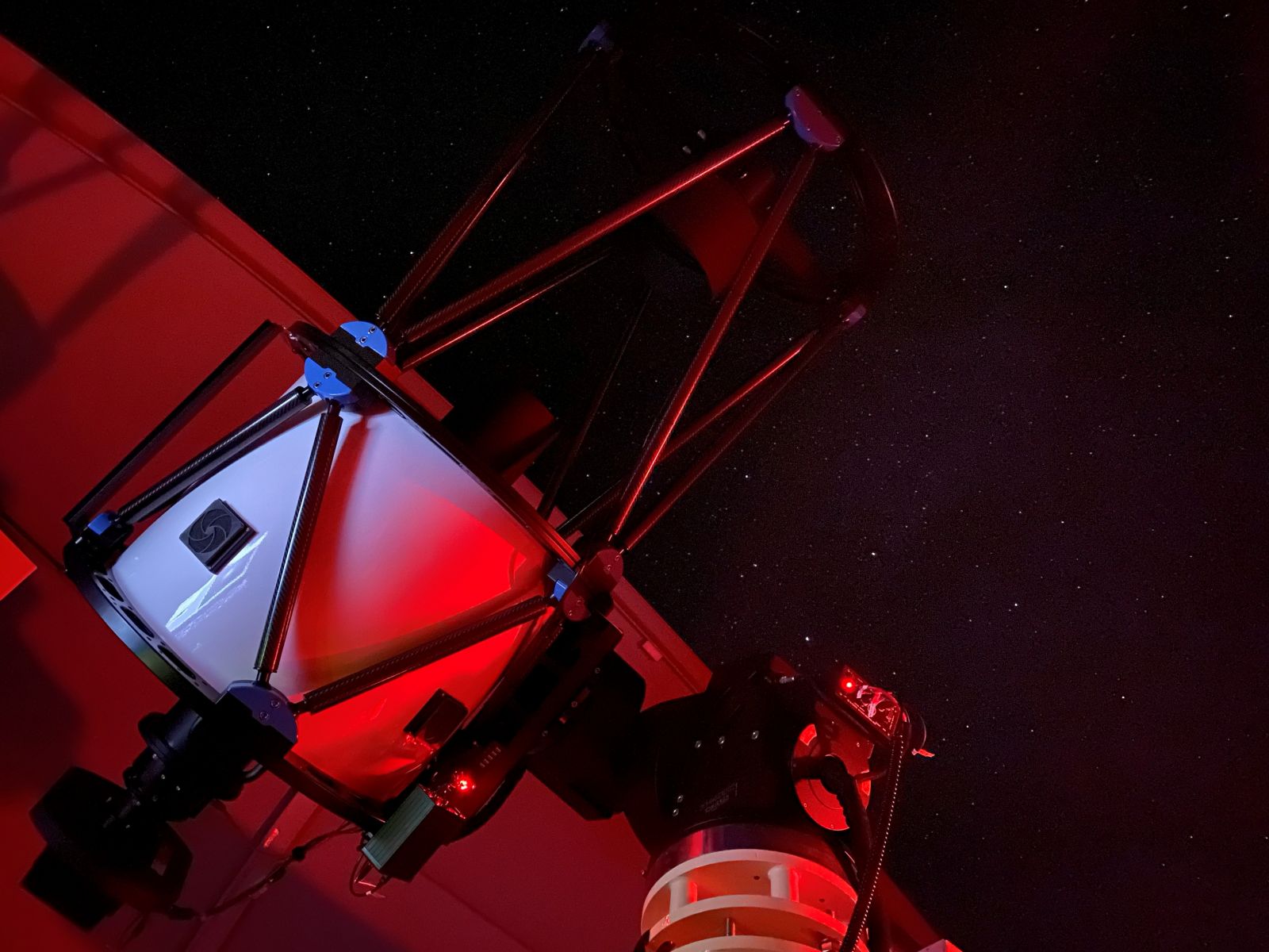 A picture of the PIRATE optical telescope within a closed dome.