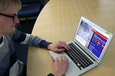 Man studying using laptop