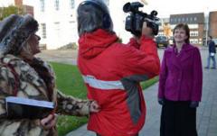 Image of media training participants with camera