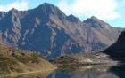 Image of mountain range viewed across lake © Clare Warren